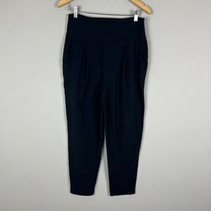 Athleta Elation Pants Women Medium Black Tapered Pleated Stretch Knit Athleisure